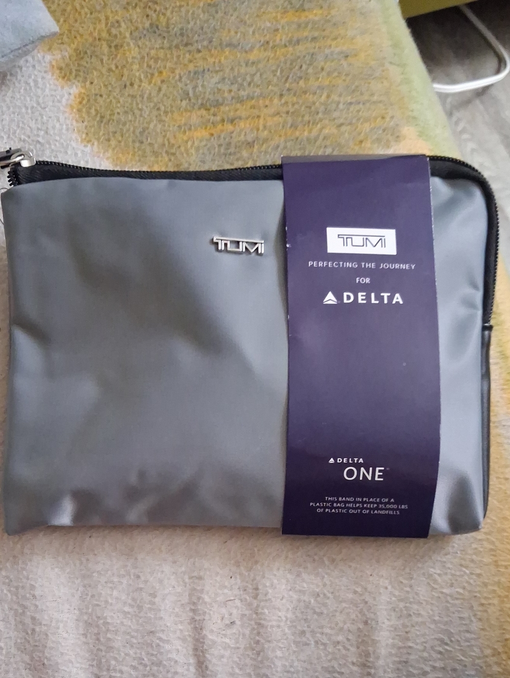 Tumi Gray Men’s Toiletry Bag with Delta One Branding